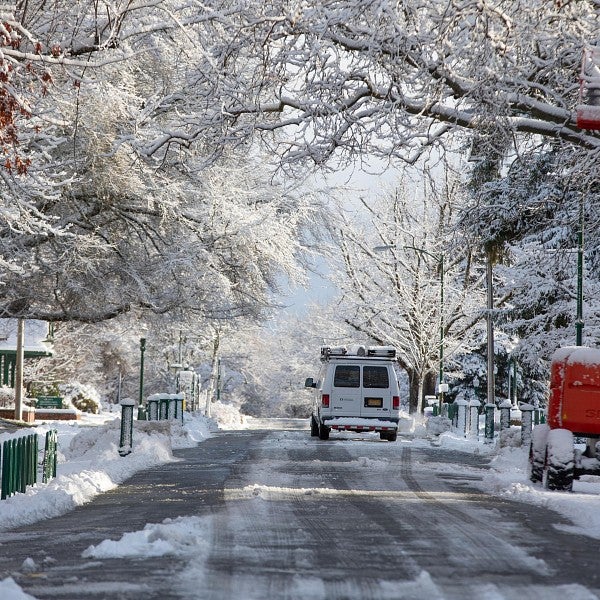 Snow on campus with construction vehicles 