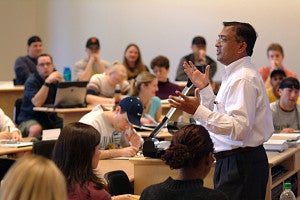Man teaching a lecture room of students