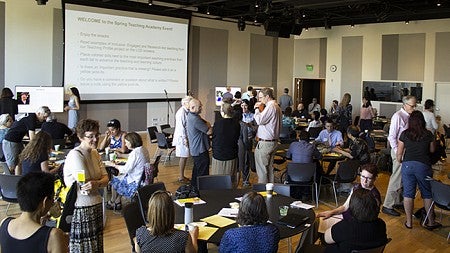 Faculty engaged in informal conversations