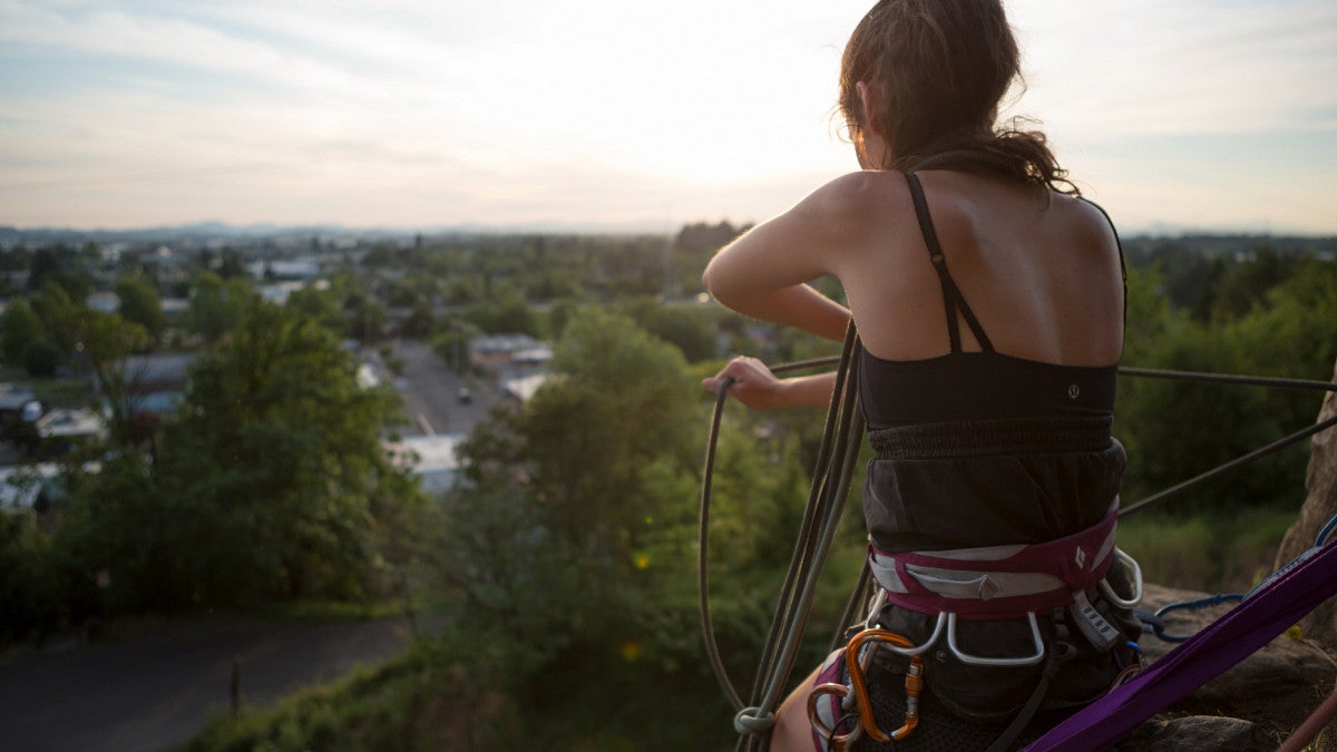 woman in climbing gear overlooks view